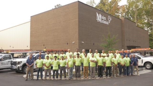Team photo outside of building